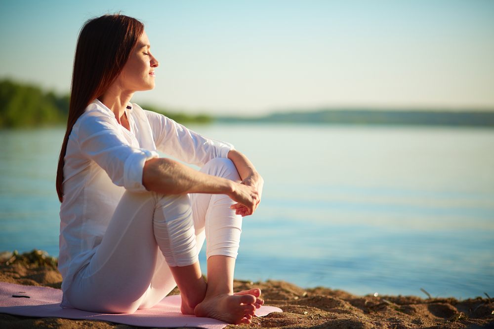 woman seated on beach